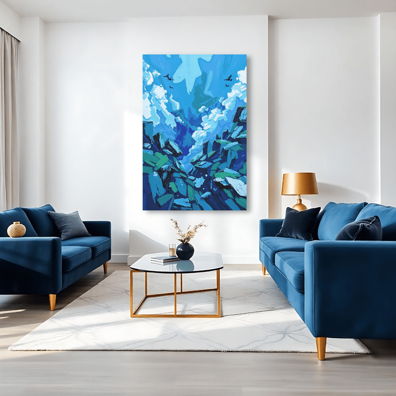 Canvas art featuring blue and white abstract floral patterns, displayed above two blue sofas in a modern living room.
